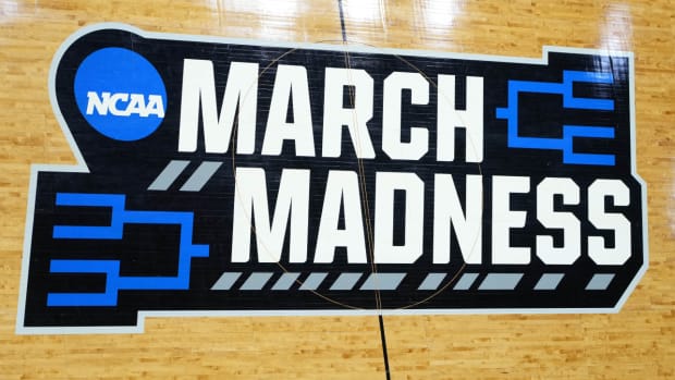 The NCAA March Madness logo is shown on a court during the 2022 tournament.